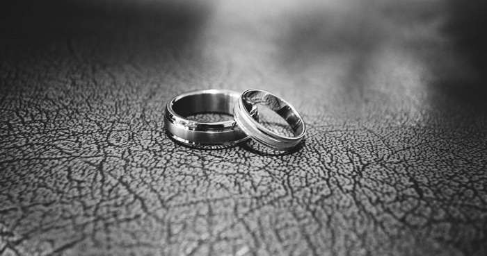 Black and white close-up of two wedding rings