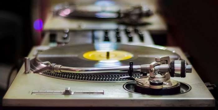 DJ turntable with vinyl record 4K