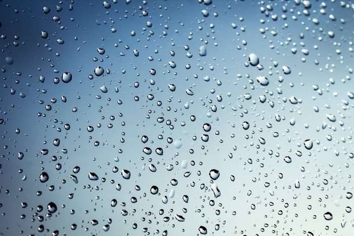 Water droplets on glass 4K