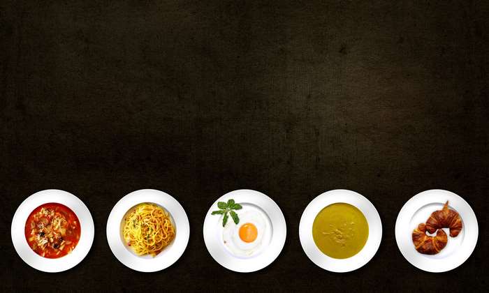 Five dishes on a dark background