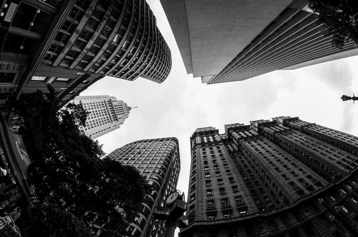 Black and white low angle view of city skyscrapers
