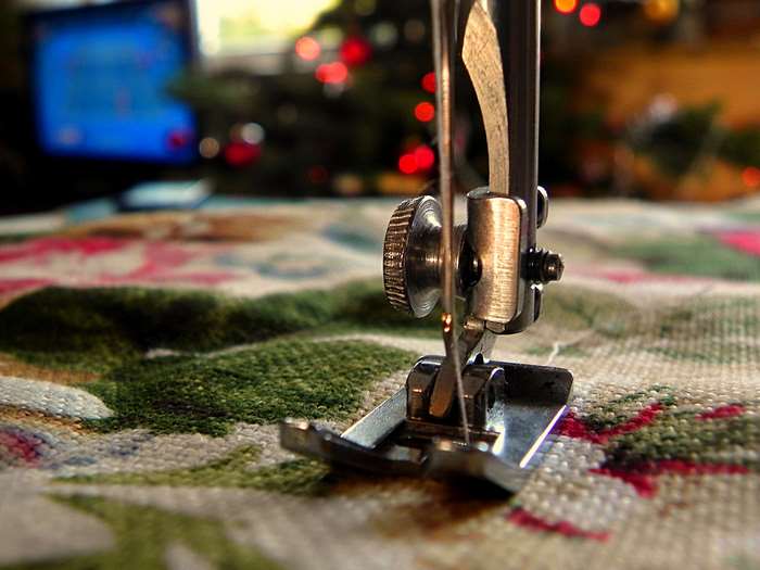 Sewing machine needle on patterned cloth