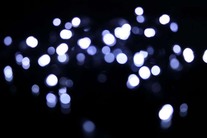 Blurry blue lights on a dark background