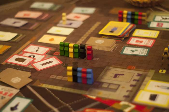 Board game with colorful playing pieces and cards