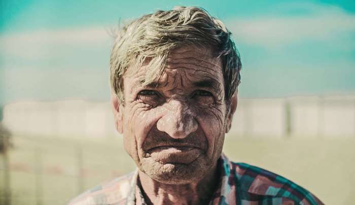Portrait of an elderly man with wrinkles
