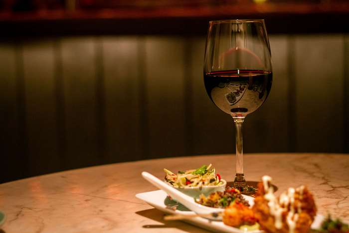 Appetizers and red wine on a table