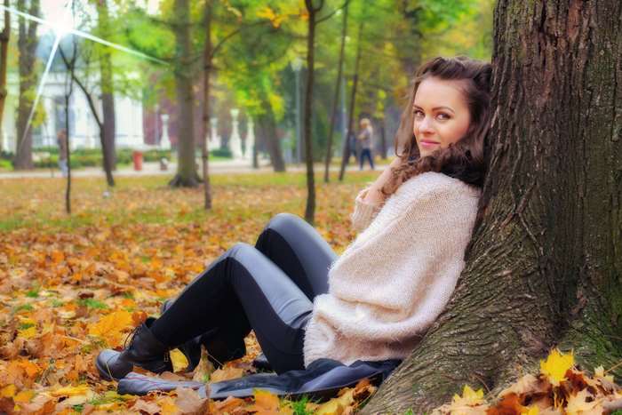 Happy Woman Relaxing in Autumn Park 4K