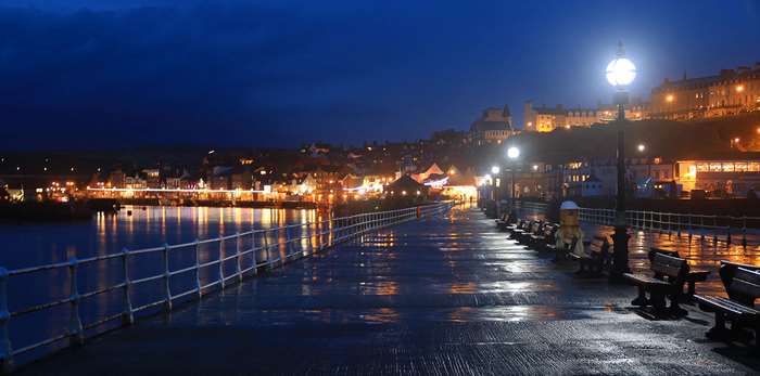 Whitby Pier at Night with Reflections