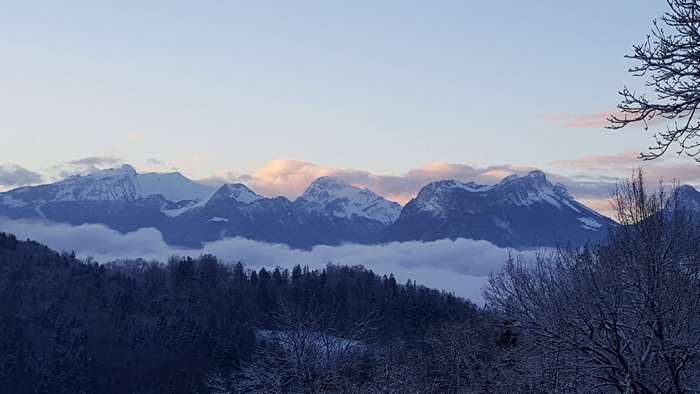 Snow-capped mountains and clouds in the Alps 4K