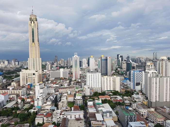 Bangkok skyscrapers under dark clouds 4K
