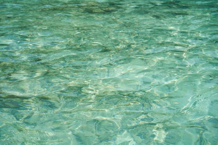 Clear turquoise water with light reflections