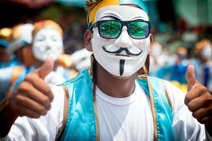 Person in Anonymous Mask at Bolivian Carnival