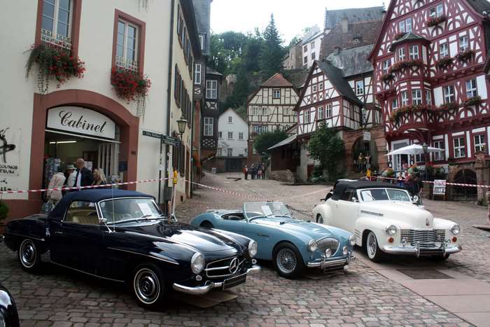 Mercedes and classic cars in a European town