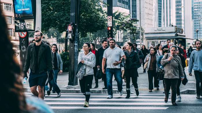 People crossing a street in a city