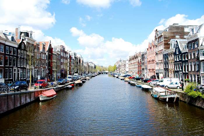 Amsterdam canal with houses and boats, Netherlands 4K