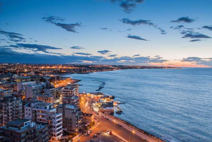 Cityscape of Bari, Italy at sunset with clouds