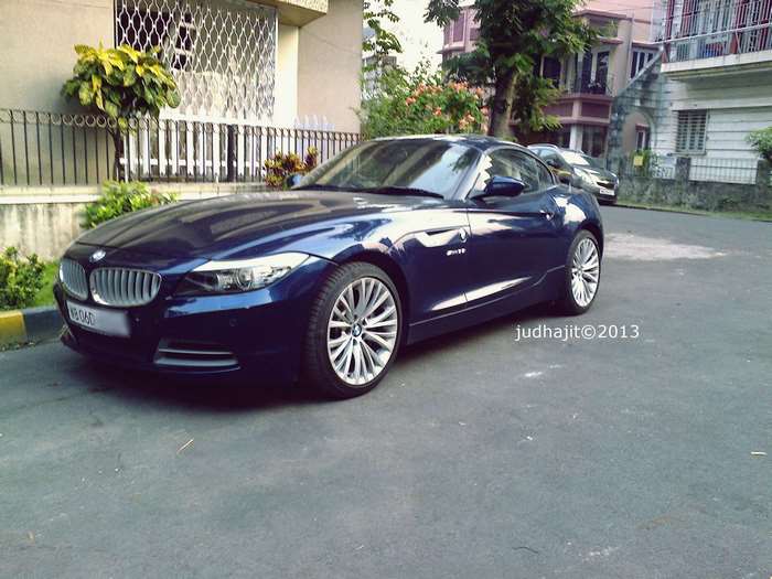 Blue BMW Z4 parked on a street