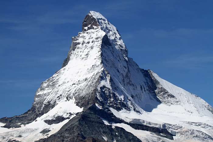 Snowy mountain peak under a clear blue sky