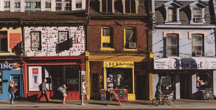 Street view of shops including Condom Shack