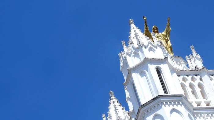 White Church with Golden Jesus Statue