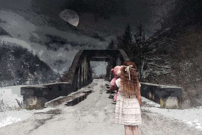 Girl with teddy bear on a bridge at night
