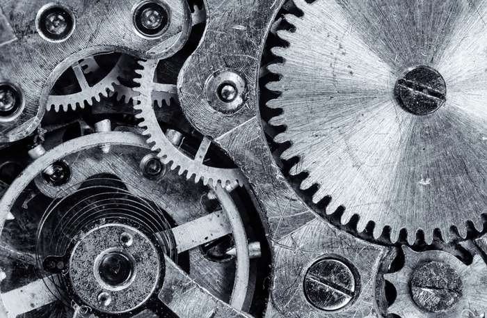 Close-up of mechanical clockwork gears and springs