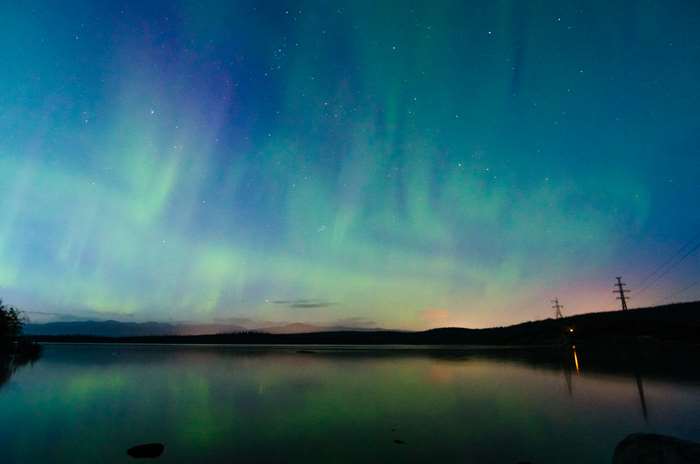 Aurora Borealis over a lake at night