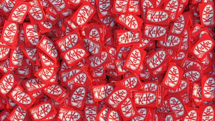 Many red Kit Kat chocolate bars