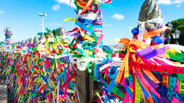 Colorful ribbons tied to a fence in Salvador, Bahia, Brazil