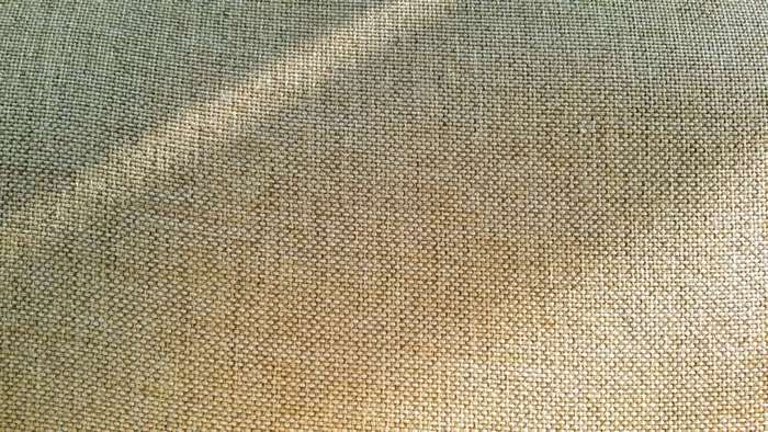Close-up of textured fabric with light and shadow