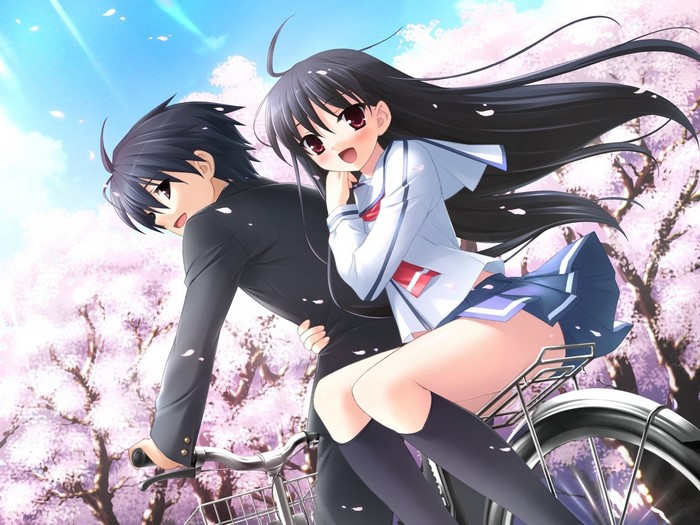 Boy and Girl Riding a Bike in Spring