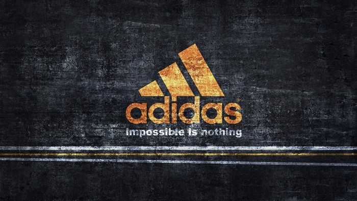 Adidas logo with "impossible is nothing" slogan
