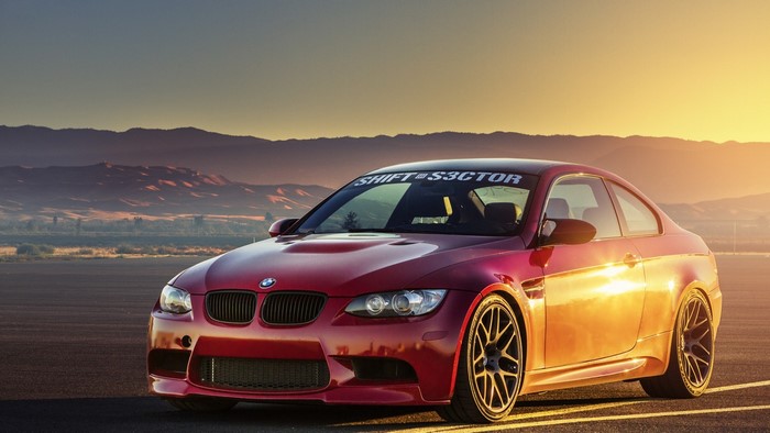 Red BMW M3 E92 Coupe with "SHIFT TO SECTOR" banner