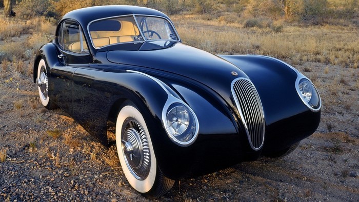Black Jaguar XK120 Coupe in Desert Landscape