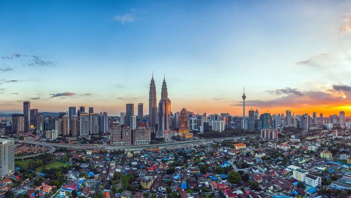 Kuala Lumpur skyline with Petronas Twin Towers at sunset