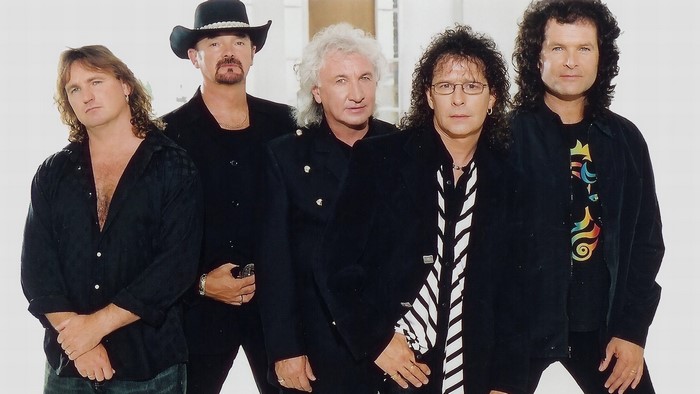 Smokie band members posing for a photo
