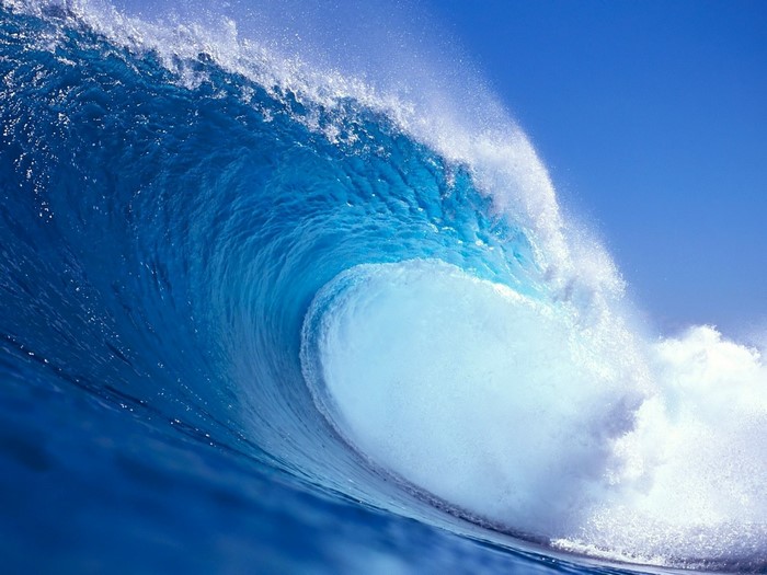 Blue ocean wave cresting
