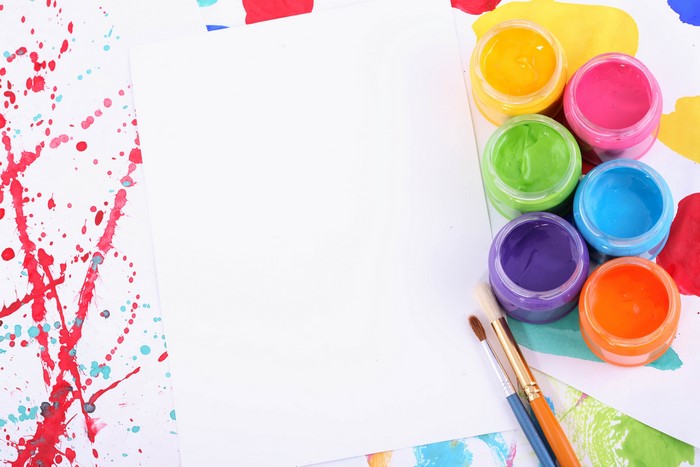 Paper with paints and brushes