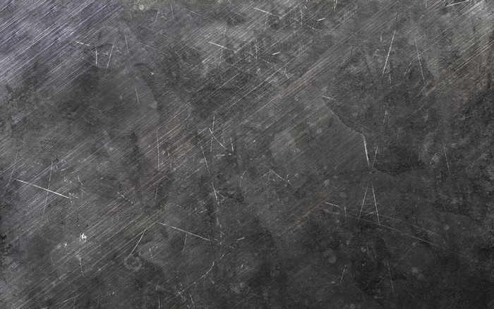 Dark scratched metal surface texture
