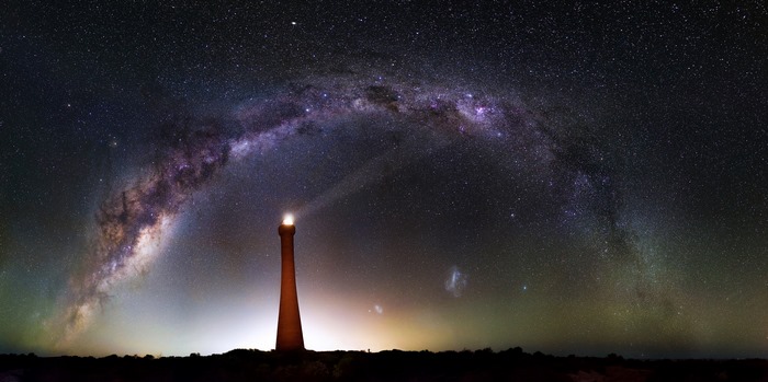 Lighthouse under the Milky Way galaxy