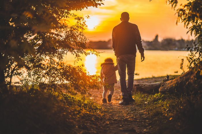 Father and Child Walking at Sunset 4K