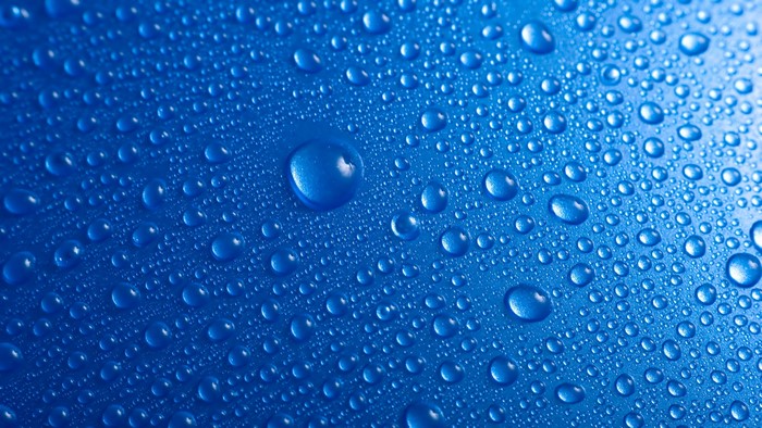 Water drops on blue surface
