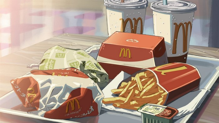McDonald's meal with burgers, fries, and drinks
