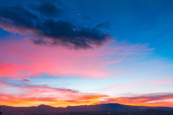 Colorful sunset sky over mountains