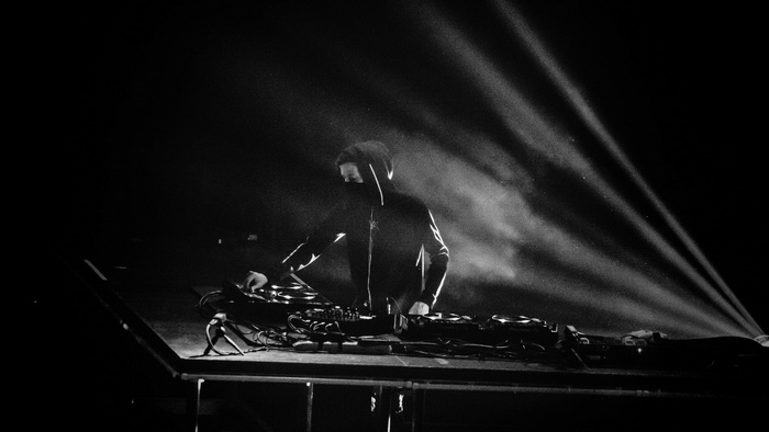 Alan Walker DJ performing in monochrome