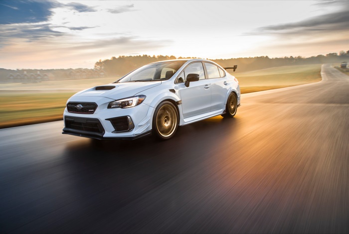White Subaru WRX STI on a race track