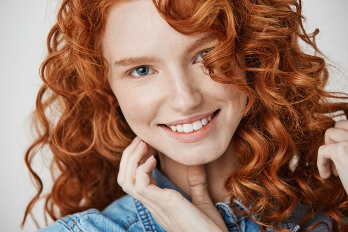 Redhead Girl with Blue Eyes Smiling