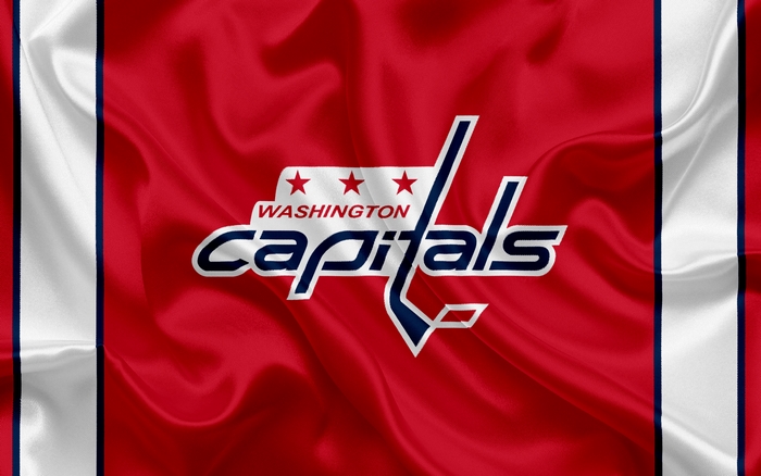 Washington Capitals logo on a red and white striped flag