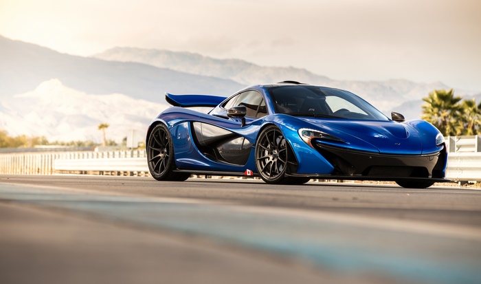 Blue McLaren P1 Supercar on a Race Track