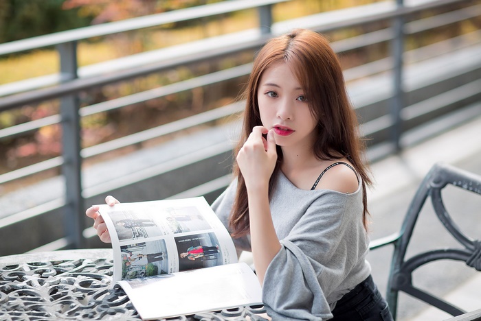 Young Asian Brunette Woman with Lipstick Outdoors